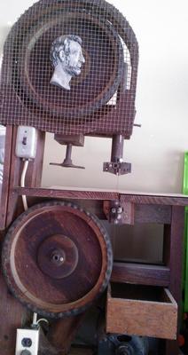This is a handmade bandsaw using a craftsman motor. 